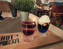 Two cocktail shooters with colours of Estonian and Latvian flags in Shot Cafe, Riga