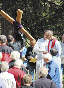 The Reverend Jerry Blake facilitated the service and recited prayers at each station, while guests took turns carrying the large wooden cross.