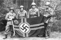 Chris Reistroffer (at far left) is pictured here with fellow soldiers on his 19th birthday. He “liberated” the Nazi flag while behind enemy lines.