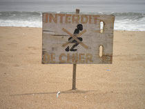 Selfexplanatory sign on the beach in Cotonou. There is a lack of proper sanitation