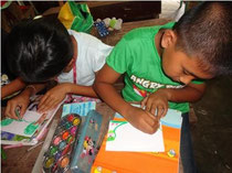 Children drawing their Greeting Card