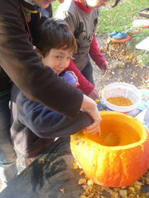 Elijah helping with the pumpkin