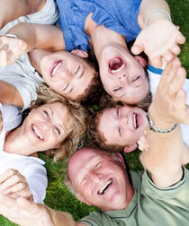 "Multi-generation Family Lying In Circle" by photostock