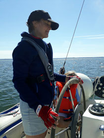 Lovisa at the helm sailing 