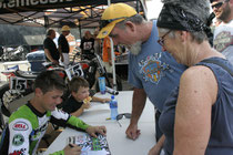 Henry Wiles signs autographs