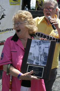 Mary Nixon, receiving a plaque from Richard Riley