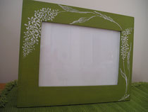 White flowers on the green photo frame