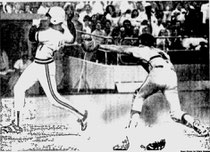 Lee Lacy eludes Bob Boone's tag to score in the 5th.