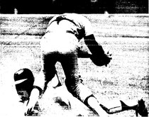 Joe Strain avoids the tag and block of Bob Boone to score.