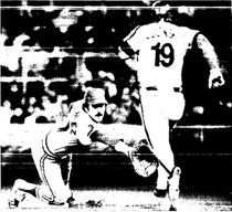 Greg Luzinski takes first as Keith Hernandez reaches for a wide throw.