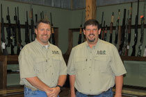 Owners Jeff Leonard and Bruce Schmitter in the firearms department at J & B Outdoors.