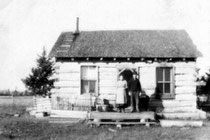 Erick and Bertha Mundahl at their homestead log cabin in North Branch, Ontario