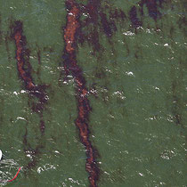 7,000 response vessels at peak. (Gregory Bull, Associated Press / June 27, 2010) A boat tows oil-absorbing material along the surface of the gulf.