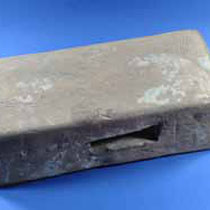 Box flue tile used to duct hot air from the underfloor heating system up the walls to let the steam out the eaves. They were used in bath houses to heat up the warm rooms. 