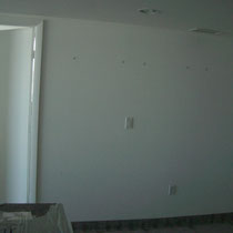 Before image of design project by Mia Home Trends featuring a staged modern entry way