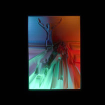 Racer Malevich without a motorbike — 3D-printed relief with variable LED lighting: the relief of the floating figure above the road is illuminated in blue, red and green.