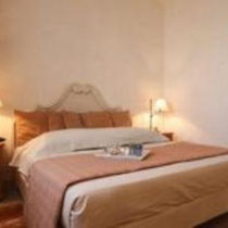 Room Touareg: First floor, windows on patio and garden, king-size bed, shower.