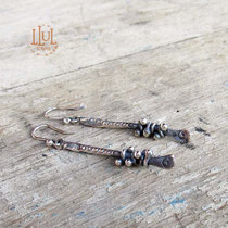 Aretes hechos a mano en plata 950.