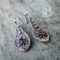 Aretes refogados hechos en plata 950.