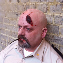 Shotgun bullet exit wound - promo for The Walking Dead