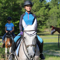 Girl is riding in a camp lesson