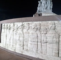 White granite frieze of choir singers on Riga's Freedom Monument