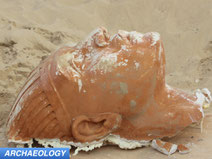 Buried movie set sphinx head uncovered