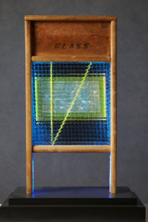 Assemblage light art sculpture made from an old glass washboard. This sculpture acts almost as a "light painting" with plexiglass, lenticular plastic, and LEDs placed in back.  The glass which refracts the light and the appearance of these components.