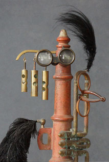 Assemblage art sculpture that is not light based. It consists of a red cast iron based that seems to be some kind of old French fire hydrant. Also included are lenses from binoculars, part of a trumpet, a large black feather, horseback riding attachment. 