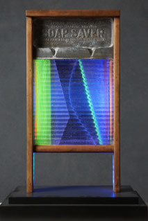 Assemblage light art sculpture made from an old glass washboard. This sculpture acts almost as a "light painting" with plexiglass, lenticular plastic, and LEDs placed in back.  The glass which refracts the light and the appearance of these components.