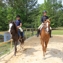 Girls enjoying a group riding lesson