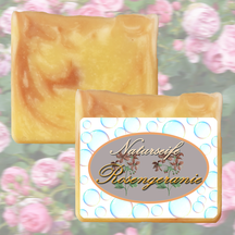 Handgemachte, rot-beige marmorierte Naturseife duftet nach Rosengeranie und Pamarosa
