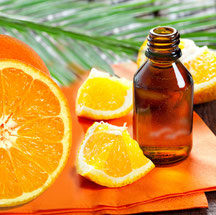 Orange vor Ölfläschchen 