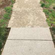 Before and after concrete pressure washing.