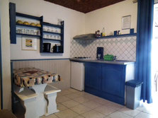 Fully equipped kitchenette in bungalow No.4 – extractor hood, hob, fridge, microwave
