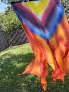 Very bold firey colors on a flex flag with cut ends