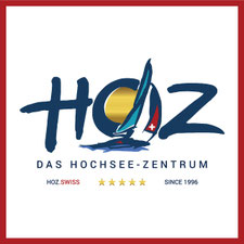 Logo des HOZ HOCHSEEZENTRUM™ mit Segelmotiv und Sonne – Symbol für Kompetenz, Qualität und nautische Exzellenz seit 1996.