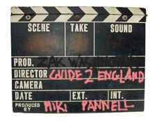 graphic of a vintage clapper-board with the ZakWashington logo