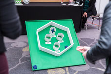 A participant plays a pocket game at the Desjardins stand to win a discount during the International Women's Day event organized by Réseau des Femmes d'affaires du Québec RFAQ in Laval photo taken by Marie Deschene photographer