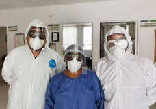 Healthcare workers wearing the distributed kits