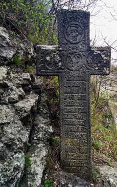 Stone cross on the hill opposite Bran Castle, Romania.