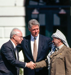 Bill Clinton with Yitzhak Rabin and Yasser Arafat at the White House in 1993 