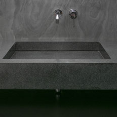 Dark solid surface countertop with integrated sink is water and mold resistant