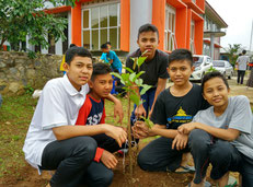 Planted Guava trees in front of the school building    Looking forward to seeing their growth!