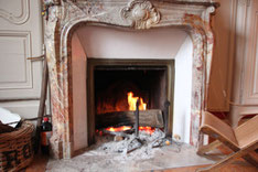 By the fireplace !