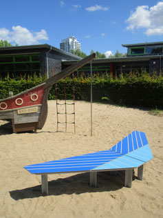 "Phantom HPL Airplane" - Play and seating platform made of HPL and steel - shape like a paper plane or airplane. Individual decor and color coating possible.
