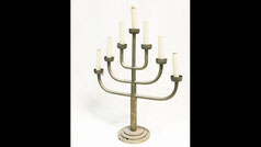 Seven-branched synagogue menorah adapted for electricity