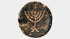 Ancient menorah, Judea. Ancient black glass token featuring a menorah