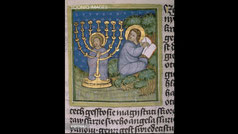 A vignette from the Olomouc Bible with menorah, St John writing the Apocalypse. Codex MIII