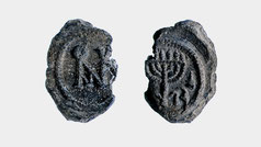 Lead Seal Impression “Bulla” depicting a menorah and the monogram of Anastasius